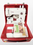 A Bernina minimatic electric sewing machine with lead and pedal.