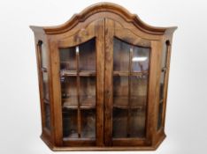 A Scandinavian stained beech glazed wall cabinet,