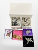 A small jewellery chest and contents, including necklaces, faux pearls, costume brooches, etc.