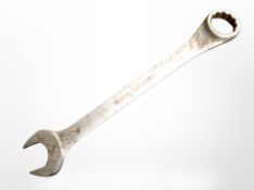 An oversized metal spanner, length 76cm.