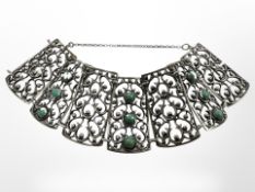 A vintage silver cuff bangle set with turquoise