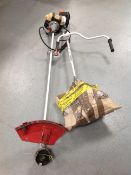 Two petrol strimmers (as found)