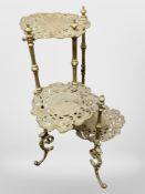 A brass three-tier plant stand,
