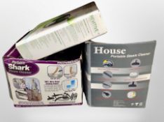 A boxed Shark steam cleaner,