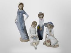 Four Nao figures of girls