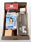 A box of new retail stock items - Drink water bottles, gaming headphones,