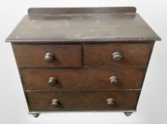 A Victorian painted pine four drawer chest,