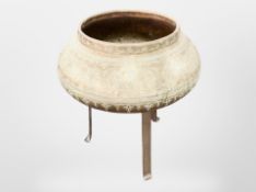An Islamic engraved brass jardiniere on metal stand, overall height 47cm.