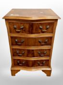A reproduction yewood four drawer chest,
