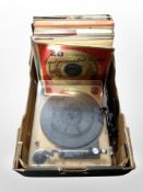 A contemporary turn table and quantity of LP records and box sets