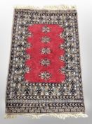 An Afghan rug of geometric design,