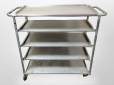An aluminium five tier catering trolley,