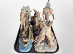 A group of diecast resin Native American figures.