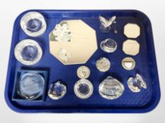 A group of crystal paperweights, mirrored stands including Swarovski,