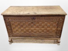A 19th century Scandinavian carved oak fall front blanket chest with key,