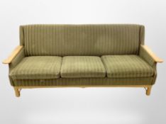 An early 20th century Danish blond oak three piece lounge suite