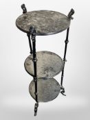 A painted metal three-tier plant stand, height 78cm, together with two plastic Tuborg crates.