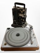 A His Master's Voice record player and a vintage projector (continental plugs).