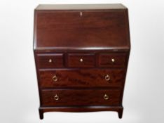 A Stag Minstrel fall front bureau,