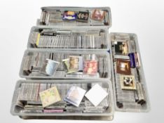 Five plastic storage boxes with lids containing a large quantity of cds