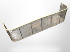 A Victorian brass and steel fire curb