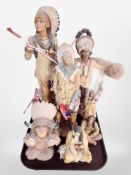 A group of diecast resin Native American figures.