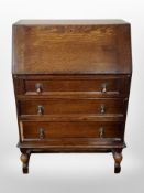 An Edwardian oak fall front bureau,