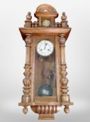 A Junghans oak-cased wall clock.