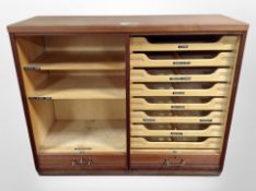 A mid 20th century Danish teak tambour fronted office cabinet, with key,