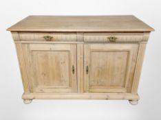 An early 20th century Continental pine sideboard,