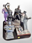 Five diecast resin Batman figures.