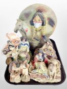 A group of diecast resin Native American figures.