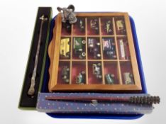 A display box of die cast vehicles, pewter Myth and Magic figure,