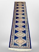 A Caucasian deign runner on blue ground,