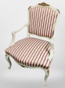 A continental painted and gilt salon armchair