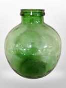 A green glass bulbous vessel, height 35cm.