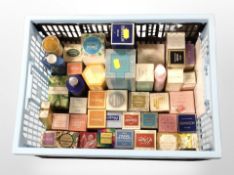 A crate containing assorted fragrances and cosmetics.