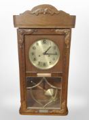 A Junghans oak-cased 8-day wall clock.