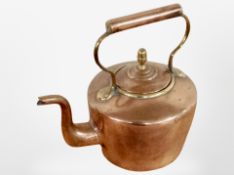A Victorian copper kettle.