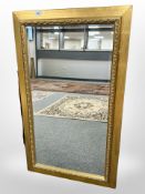A contemporary bevelled mirror, 59cm x 99cm.