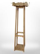A pine hat and coat stand,