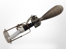 A continental table lamp manufactured from an inert mortar shell, height 49cm.