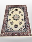 A machine made Chinese-design rug,,