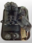 A pair of Halina 16 x 50 binoculars, two further pairs of binoculars, neck straps, etc.