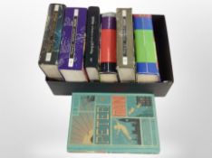 A group of volumes including Harry Potter, Peter Pan by J. M. Barrie.