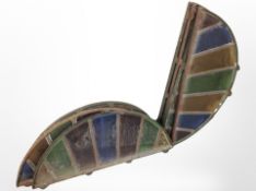 A group of eight 19th century cast iron framed demi lune stained glass windows,