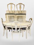 A late 19th century Scandinavian painted and gilt oval dining table with four additional leaves