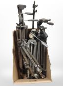 A box of camera tripods.