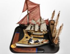 A group of model ships, boomerangs, etc.