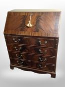 A reproduction mahogany writing bureau,